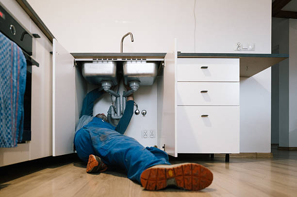 Professional Emergency Plumber technician working in Saint Johns, MI